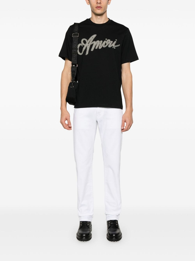 Amiri Script Logo T-shirt in zwart